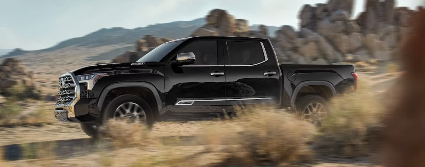 Black 2026 Toyota Tundra off-roading on sand