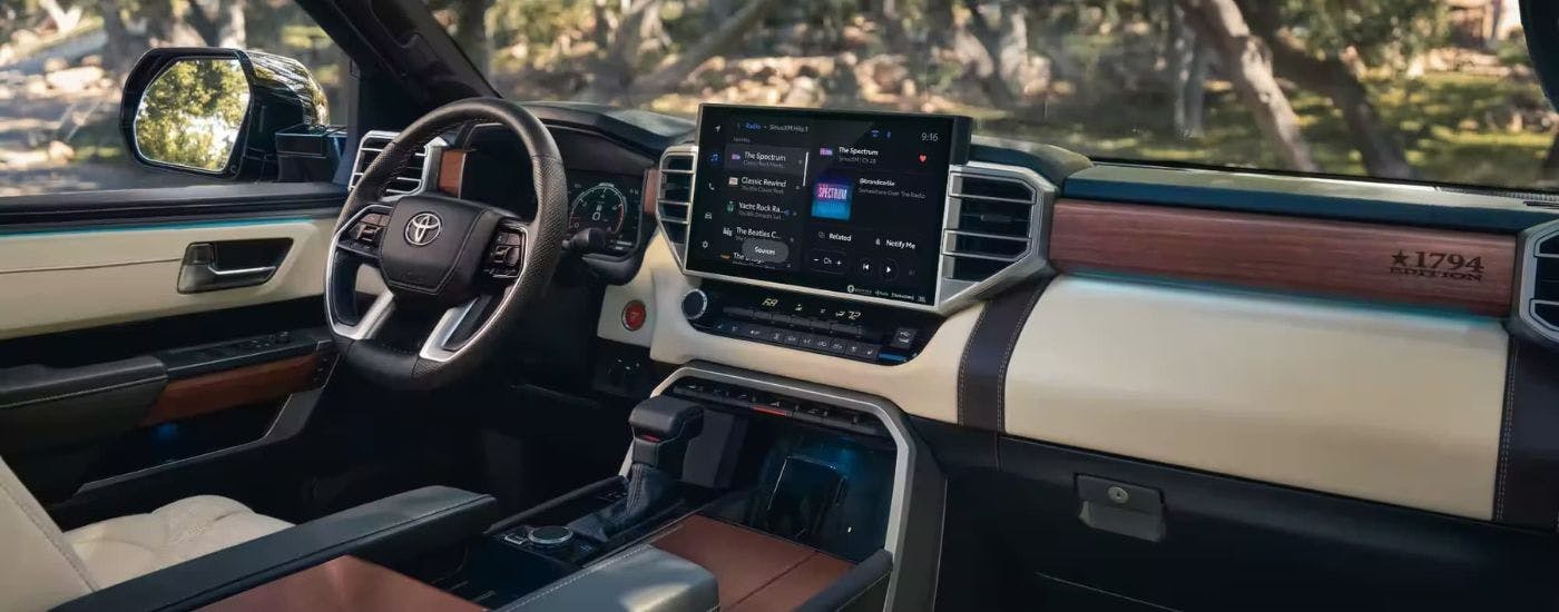 The interior of a 2024 Toyota Tundra 1794 Edition is shown from the passenger side.