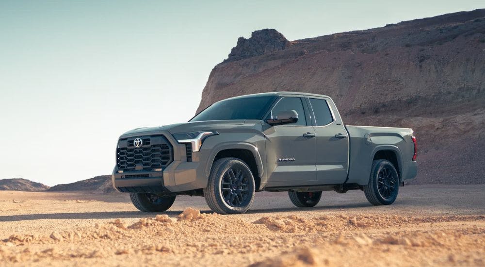 A grey 2024 Toyota Tundra is shown from the side.