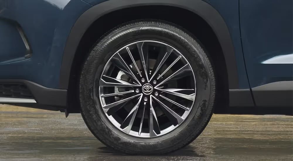 A tire and rim on a parked Toyota vehicle