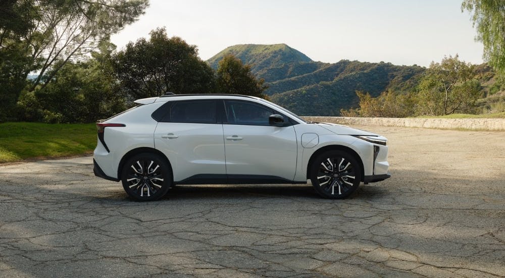 White 2026 Toyota bZ for Sale parked on a vacant lot