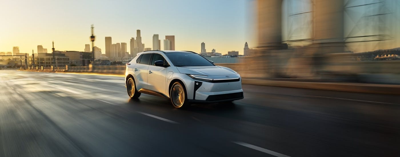White 2026 Toyota bZ for sale from driving past a city