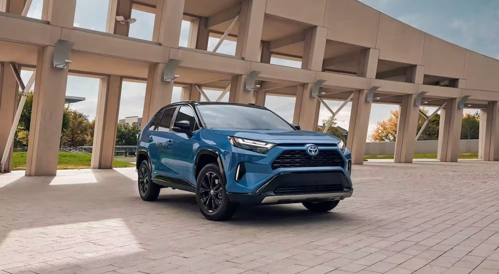 A blue 2022 Toyota RAV4 is shown from the front at an angle after leaving a used Toyota dealer near Vinings.