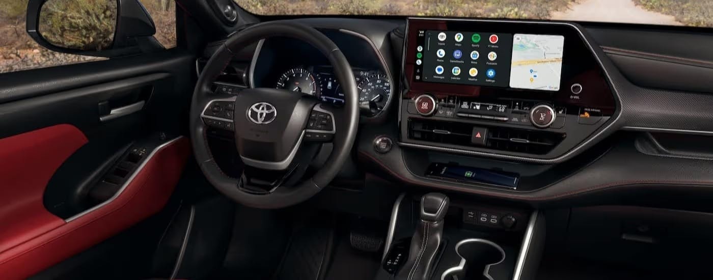 Black and red interior and dash in a 2023 Toyota Highlander