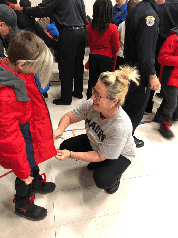 Volunteer helping a child