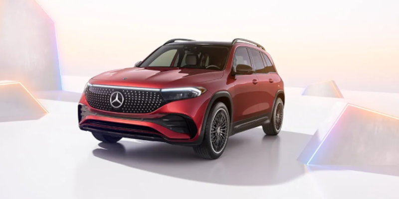 red ev suv parked on white floor