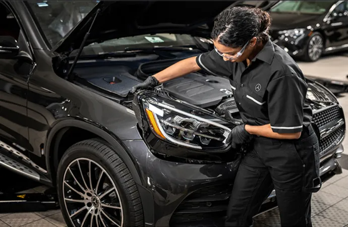 Mercedes-Benz service professional performing vehicle maintenance