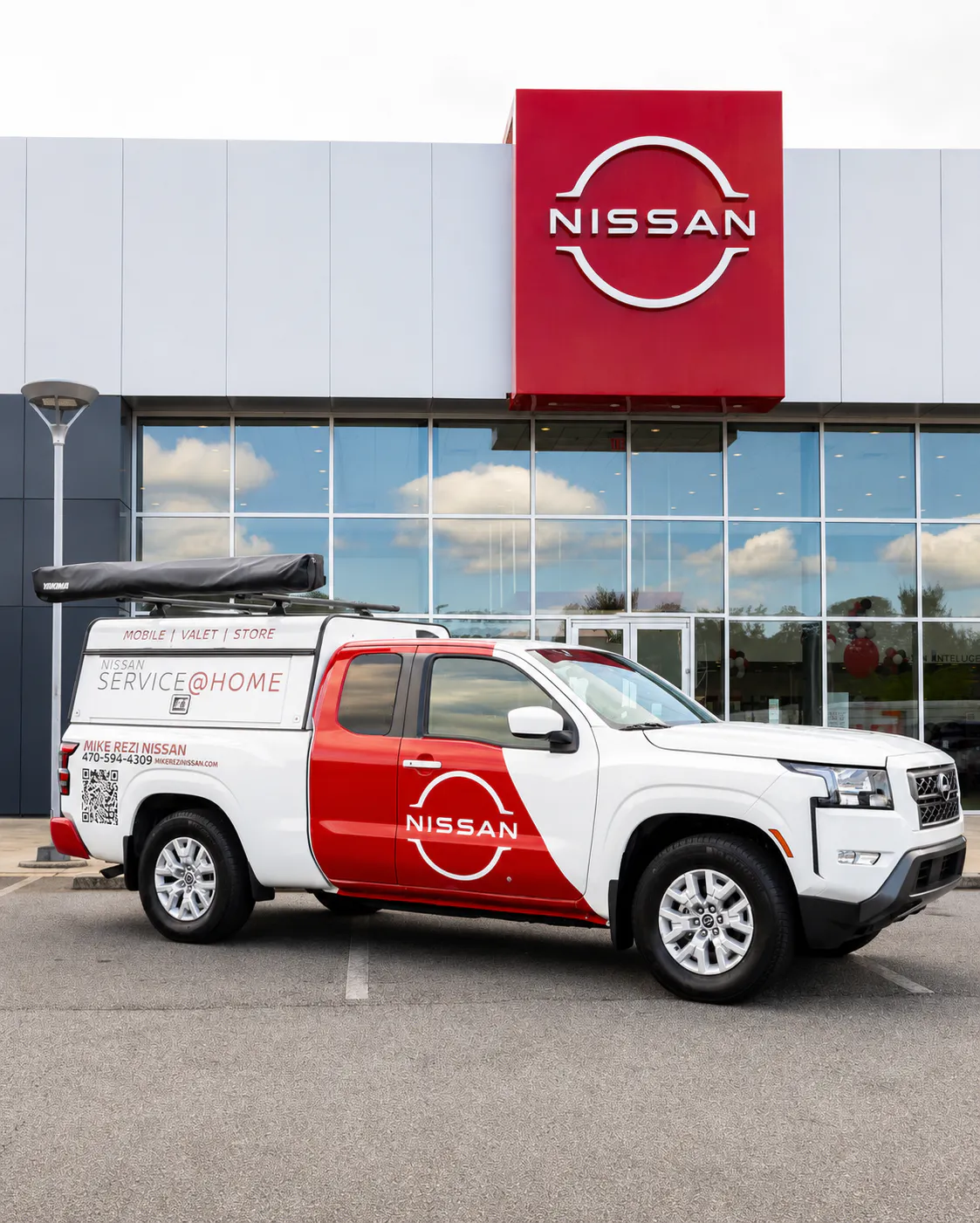 Mike Rezi Nissan Mobile Service truck outside dealership