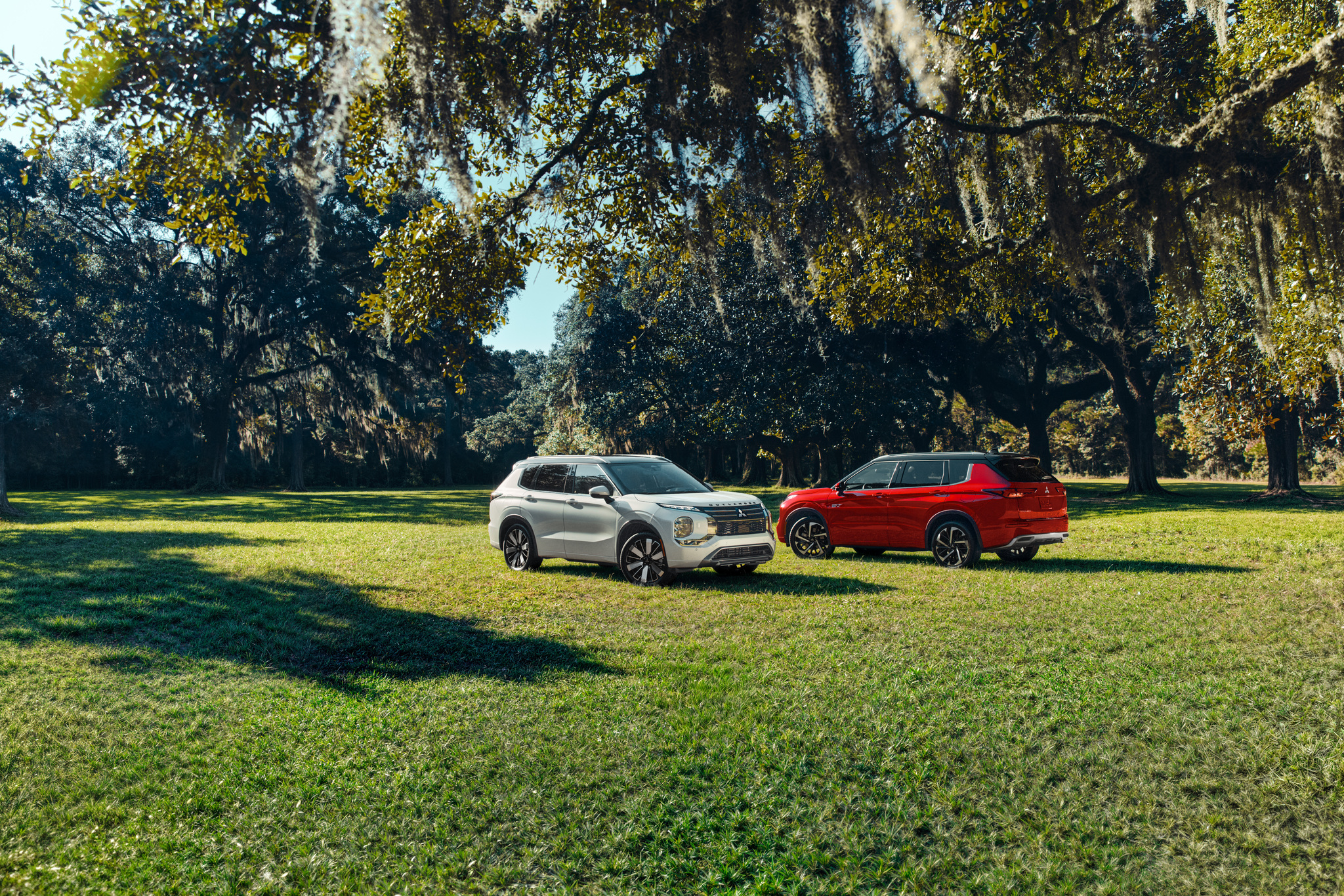 Mitsubishi vehicles parked in a scenic outdoor setting