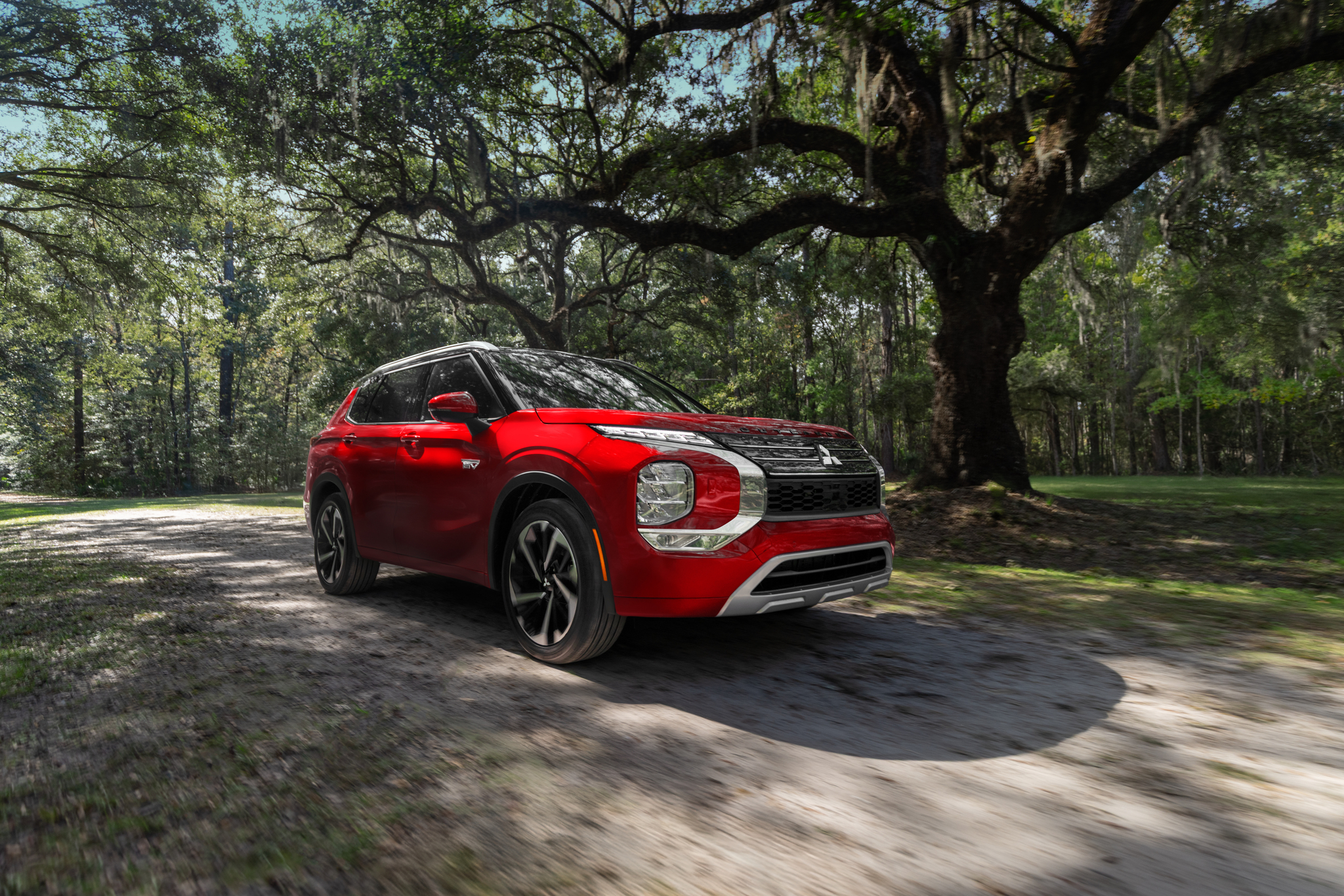 Red Mitsubishi Outlander Plug-in Hybrid low angle side profile