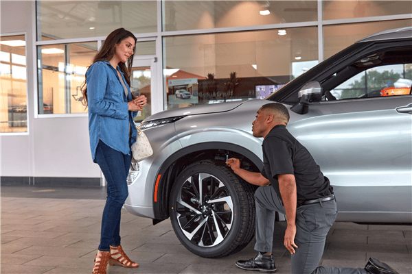 checking tires at dealership