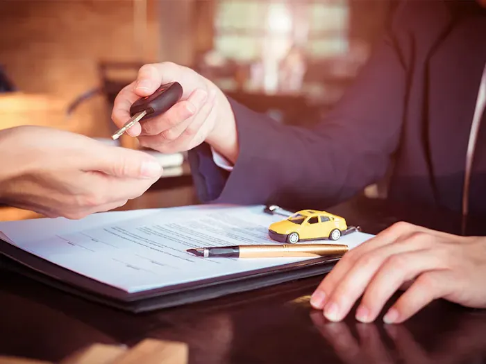 Financing paperwork at Nissan of Macomb in Clinton Township MI