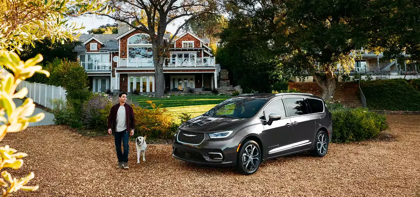 Pacifica outside with man and dog
