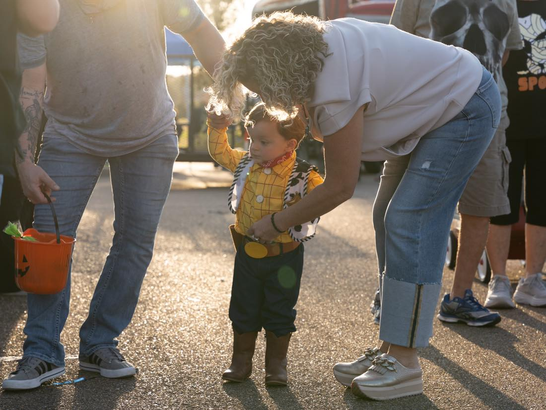 a young man dressed as Woody for Halloween
