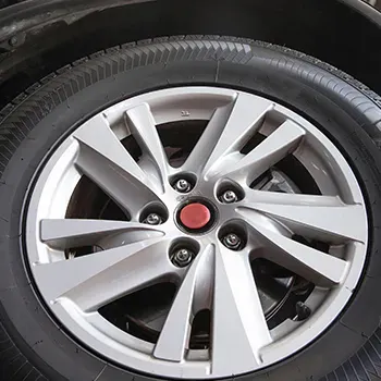 Close up image of a wheel and tire with red center cap