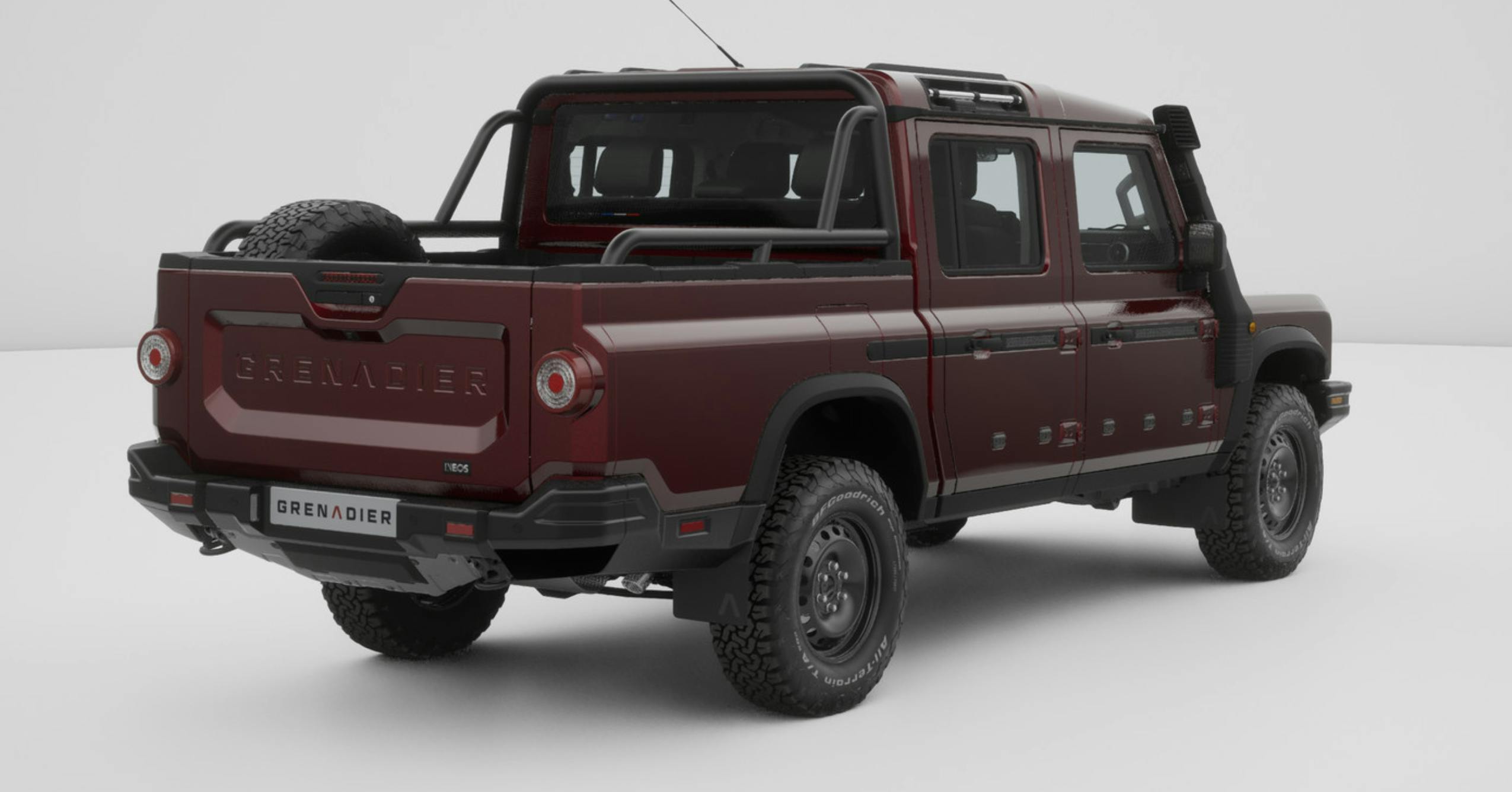 INEOS_TRIALMASTER__Exterior-01 A garnet colored Grenadier Quartermaster brake lights and back of vehicle