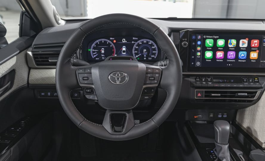 2025 Toyota Camry XLE interior with large touchscreen and digital gauges