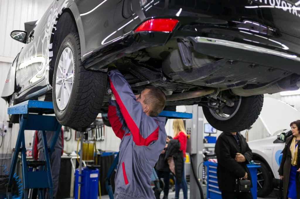 service tech under vehicle service tech under wheelbase
