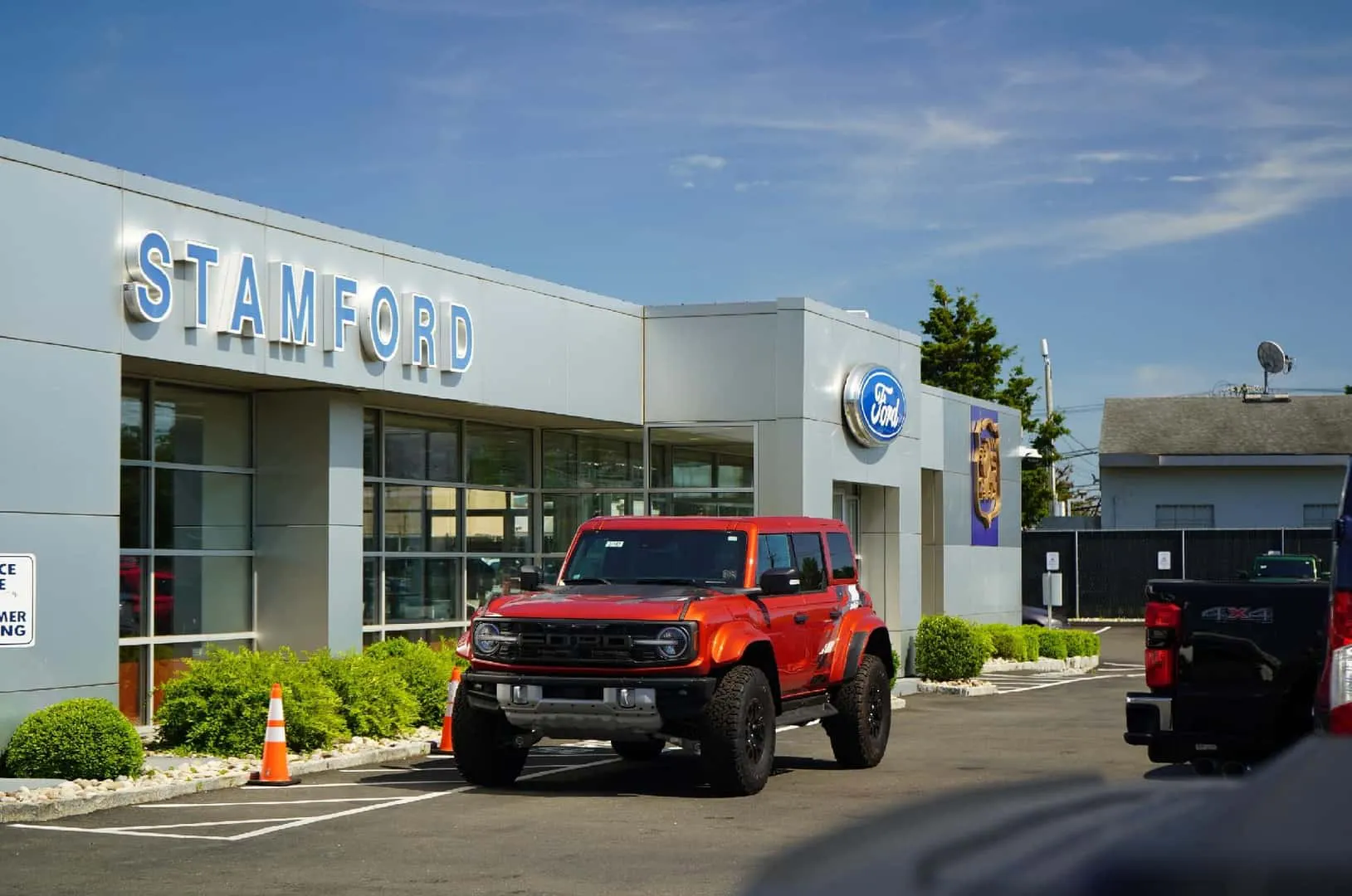 Exterior and Signage of Stamford Ford with a Ford Bronco Parked