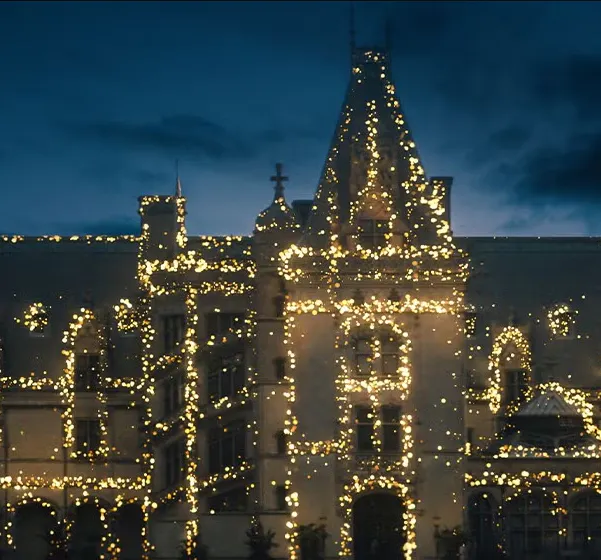 White building covered in Christmas lights
