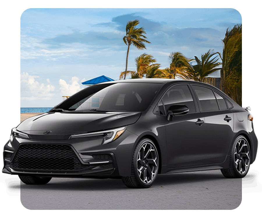 Toyota sedan with Palm trees in the background