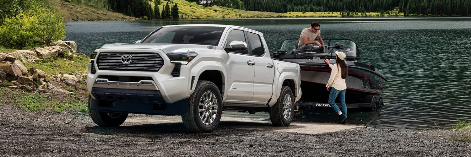 A couple hooking up their boat to the 2024 Toyota Tacoma