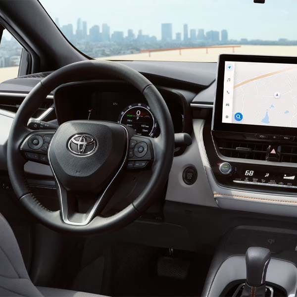 Interior dashboard and steering wheel of 2025 Toyota Corolla.