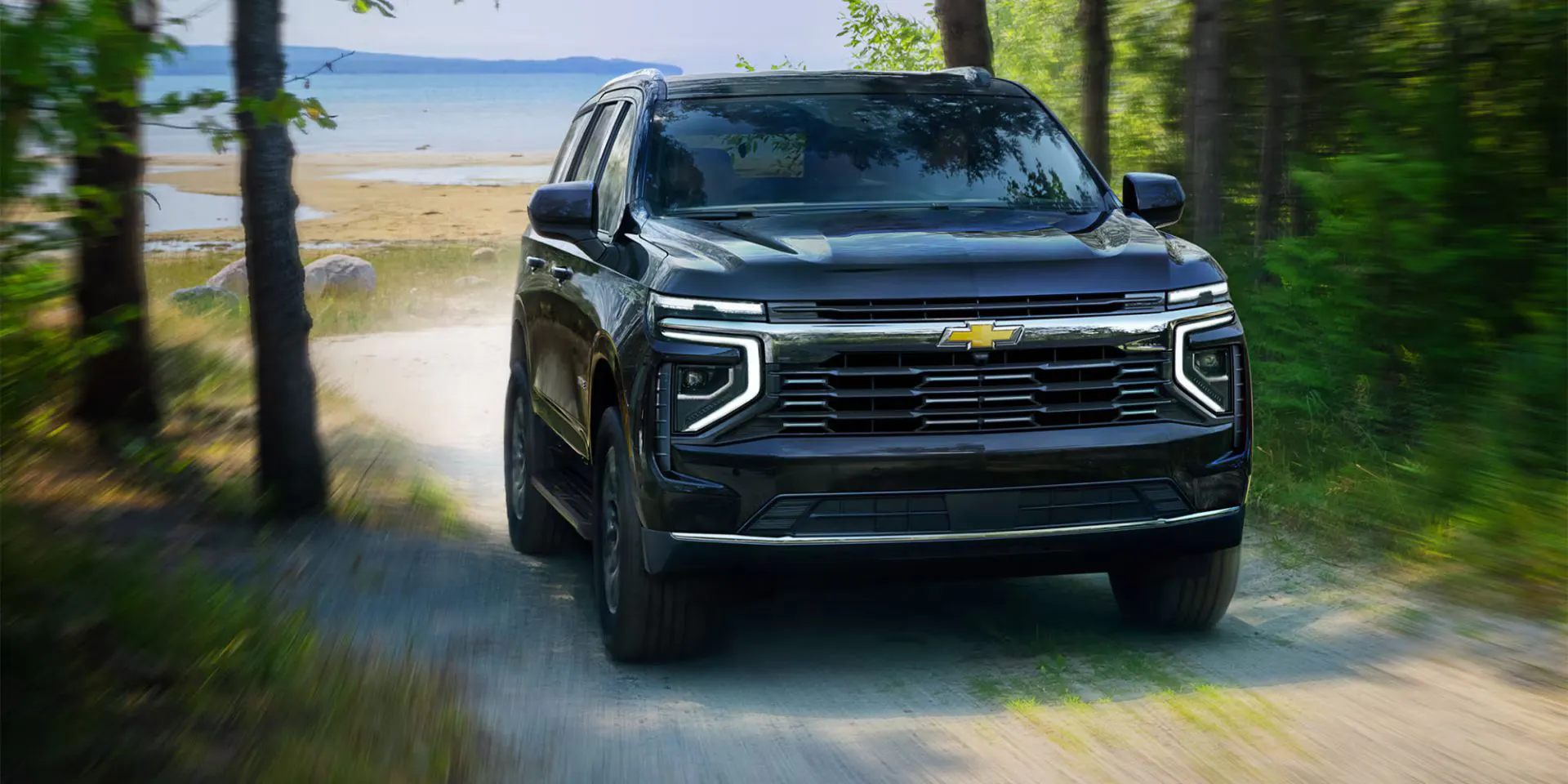 A tahoe driving off-road.