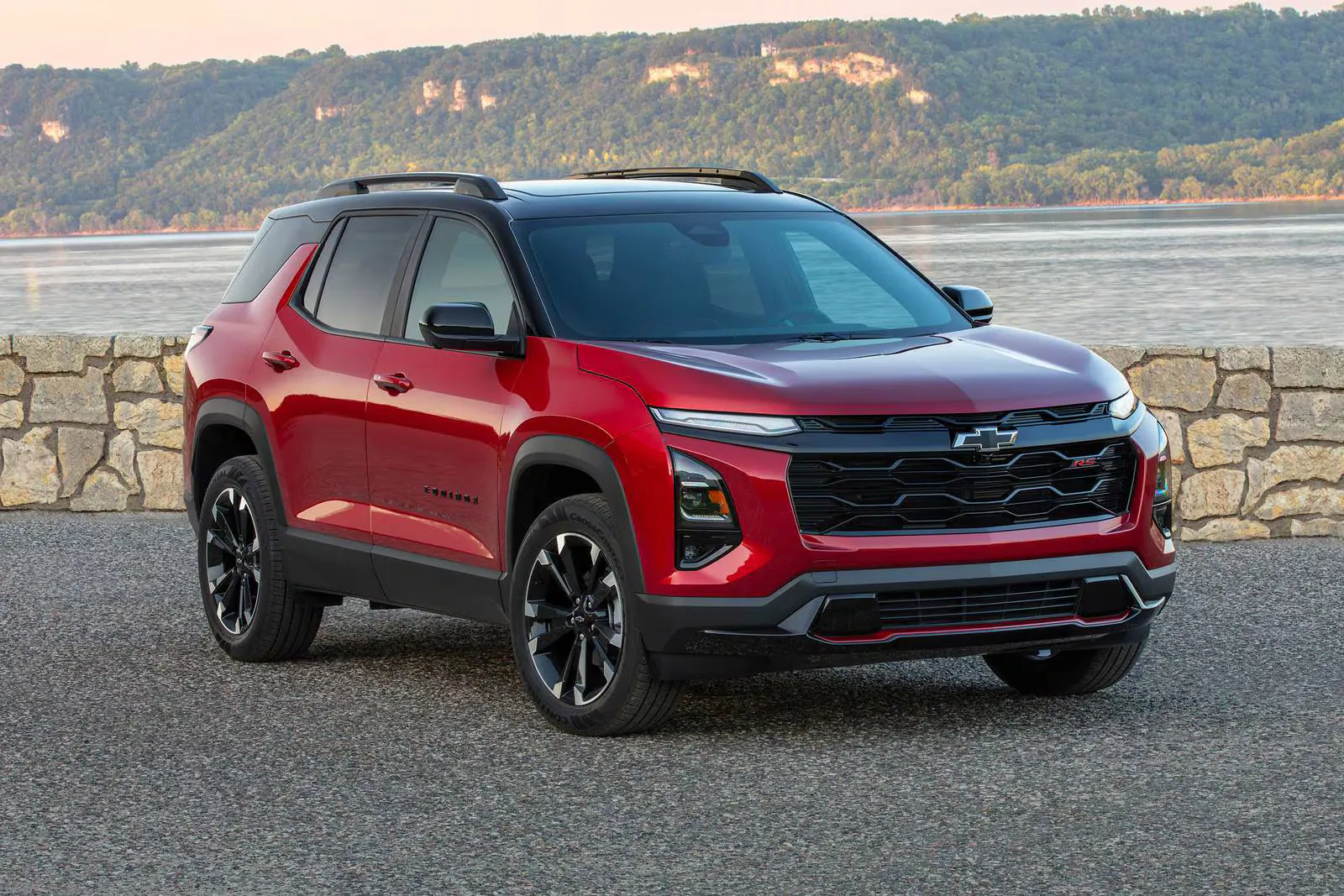 A red suv sitting parked.