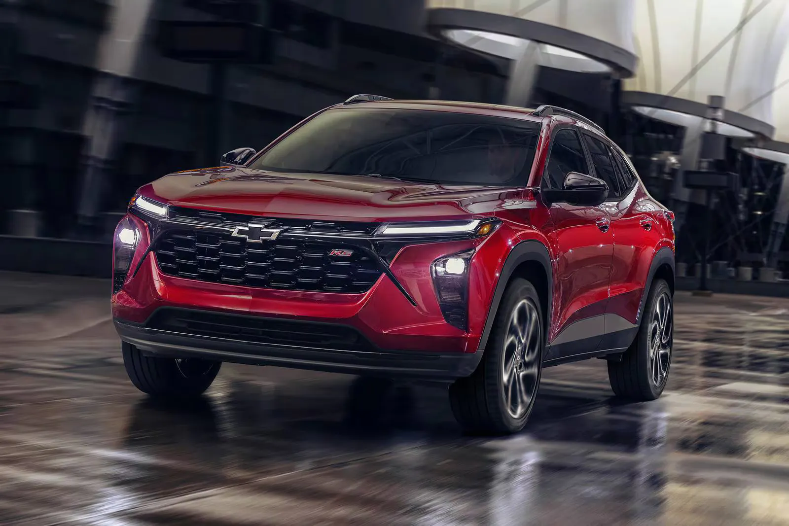 2025_chevrolet_trax_4dr-suv_2rs_fq_oem_3_1600x1067 A red trax driving on the road.