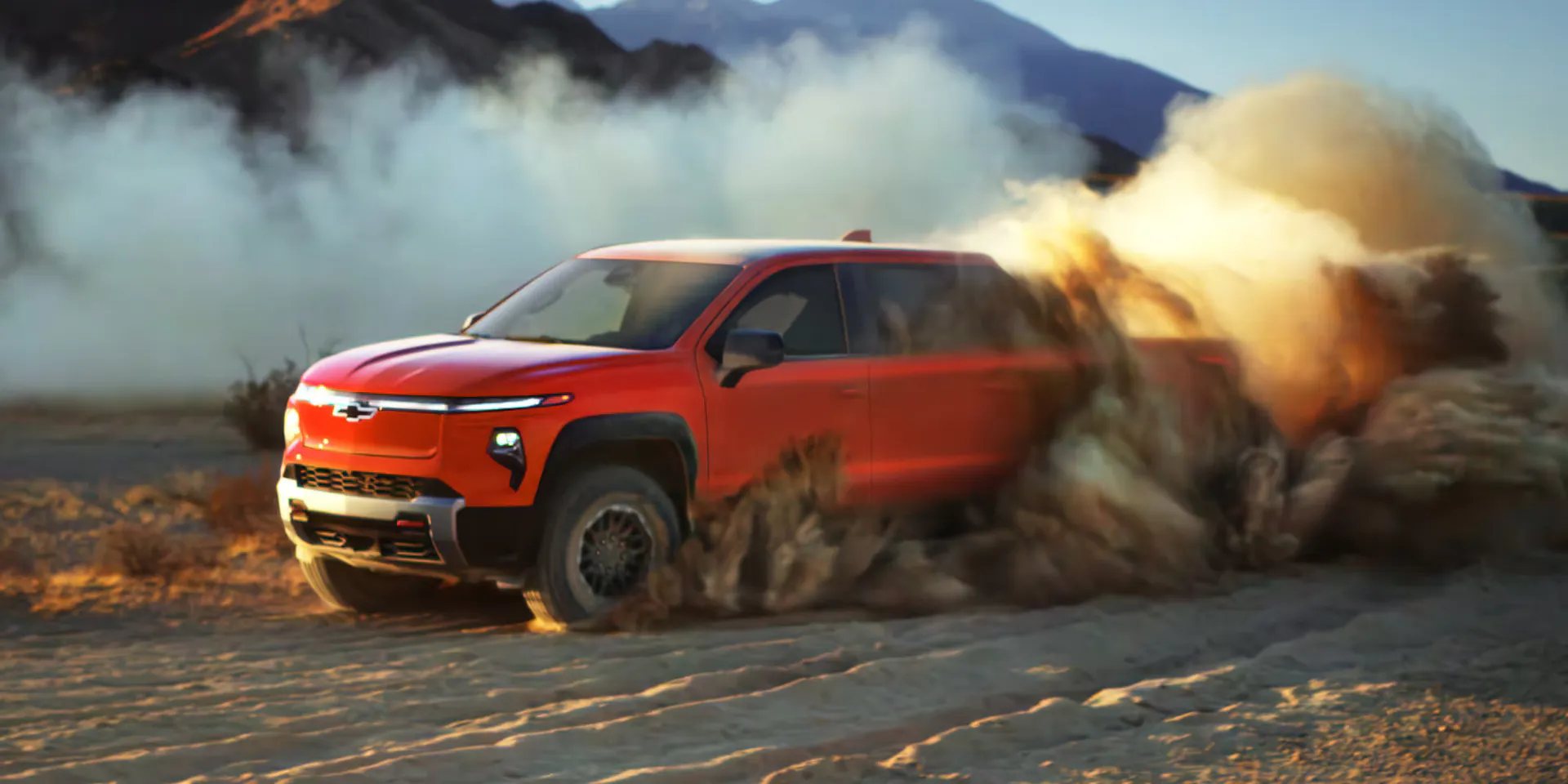 a view of the new 2026 chevy silverado ev driving in the desert