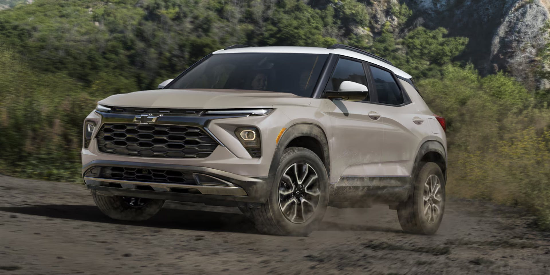 chevy trailblazer parked on a dirt road