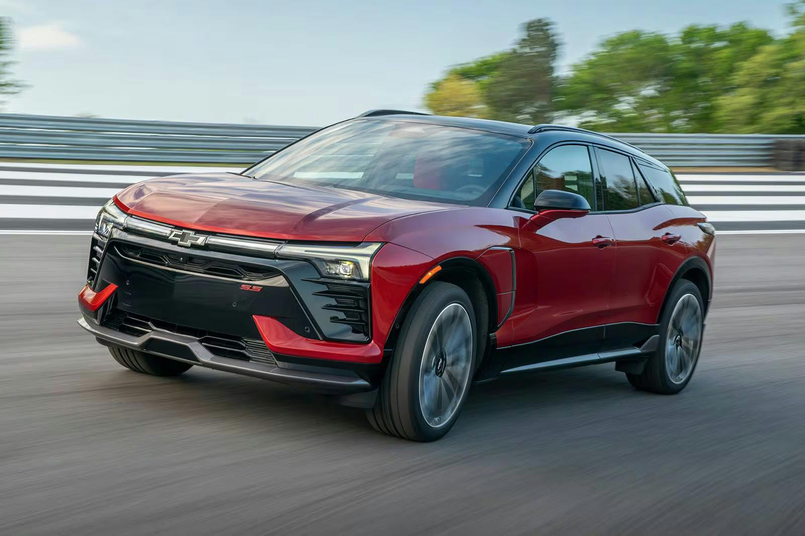 red chevy blazer ev driving on a road