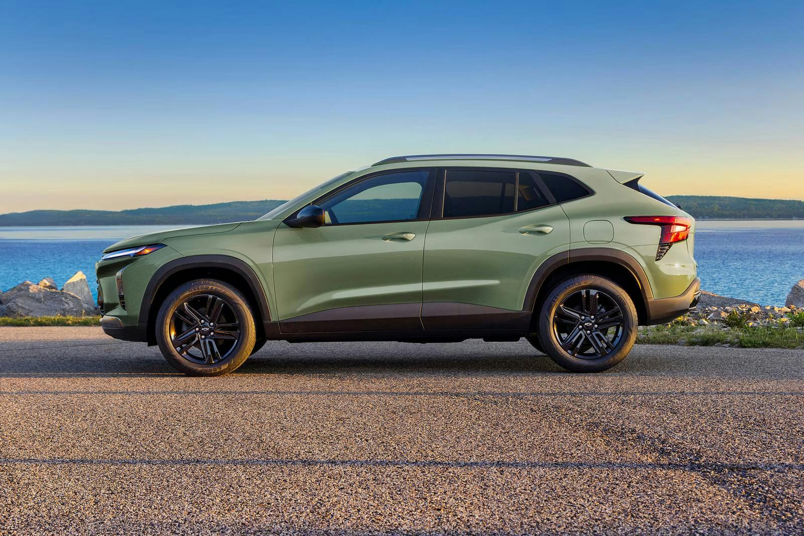 A green chevy trax sitting parked.