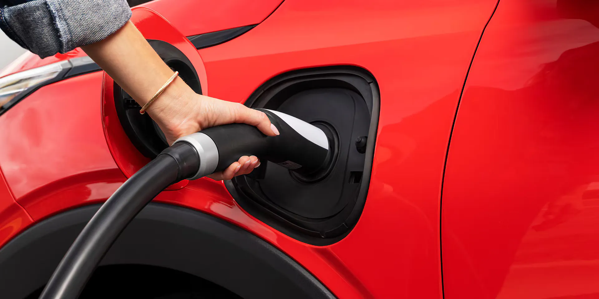 2027-bolt-ext-gal-6 The 2027 Chevrolet Bolt being plugged into a charger