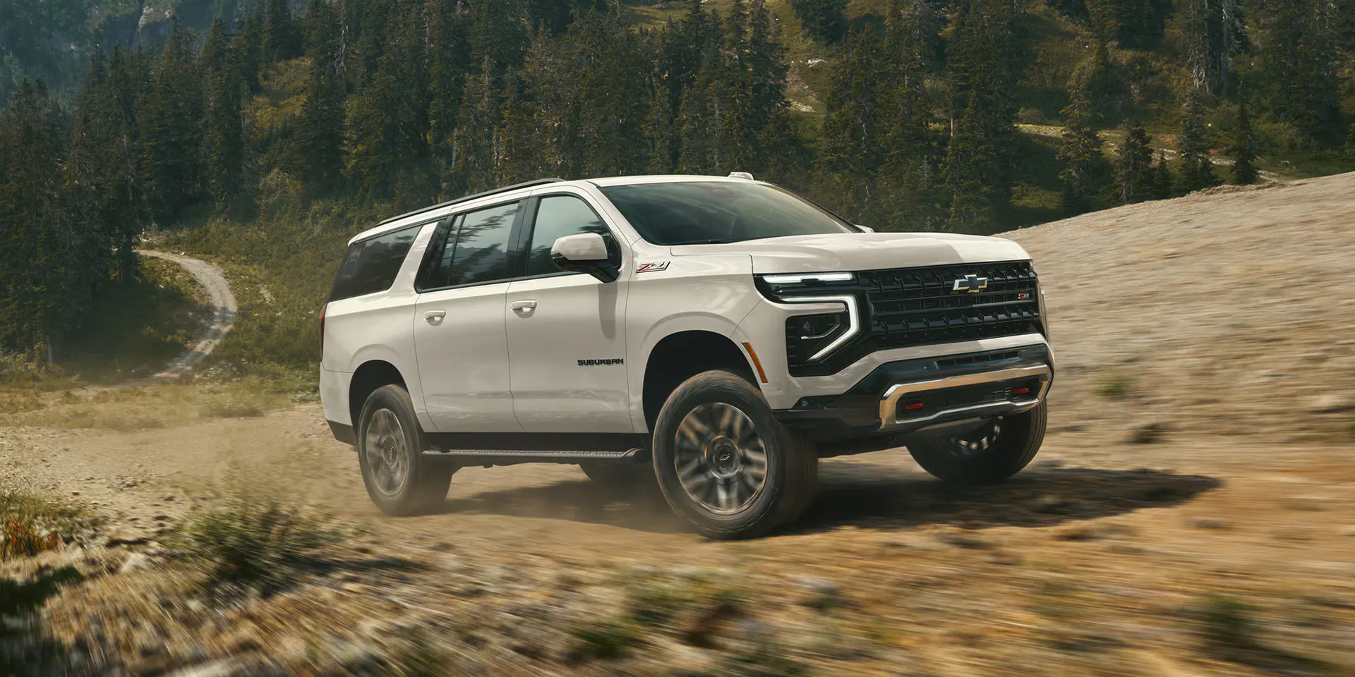 gallery-ext-layer-08 The 2027 Chevy Suburban driving up a hill