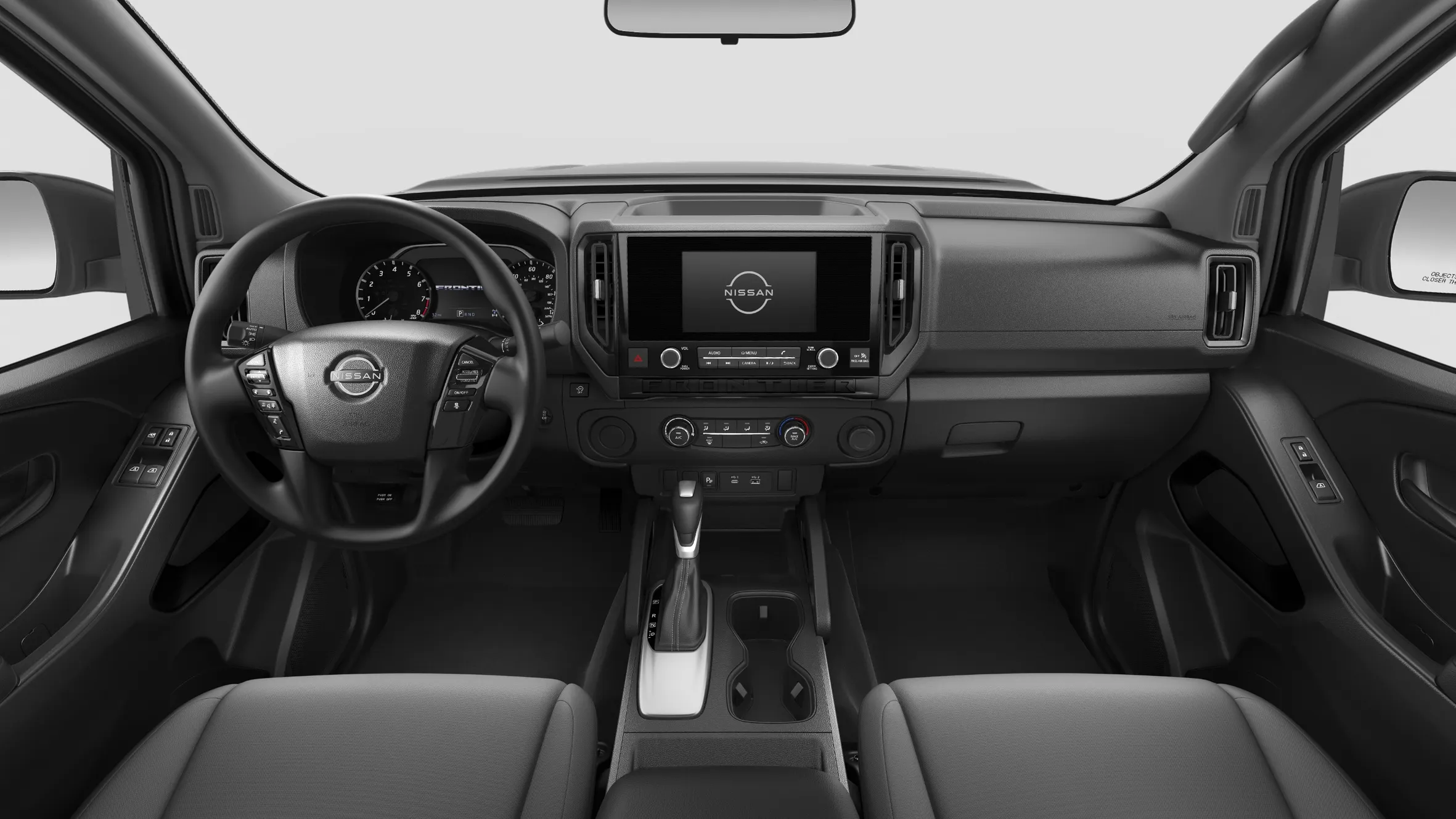 2026 Nissan Frontier towing a travel trailer on the highway